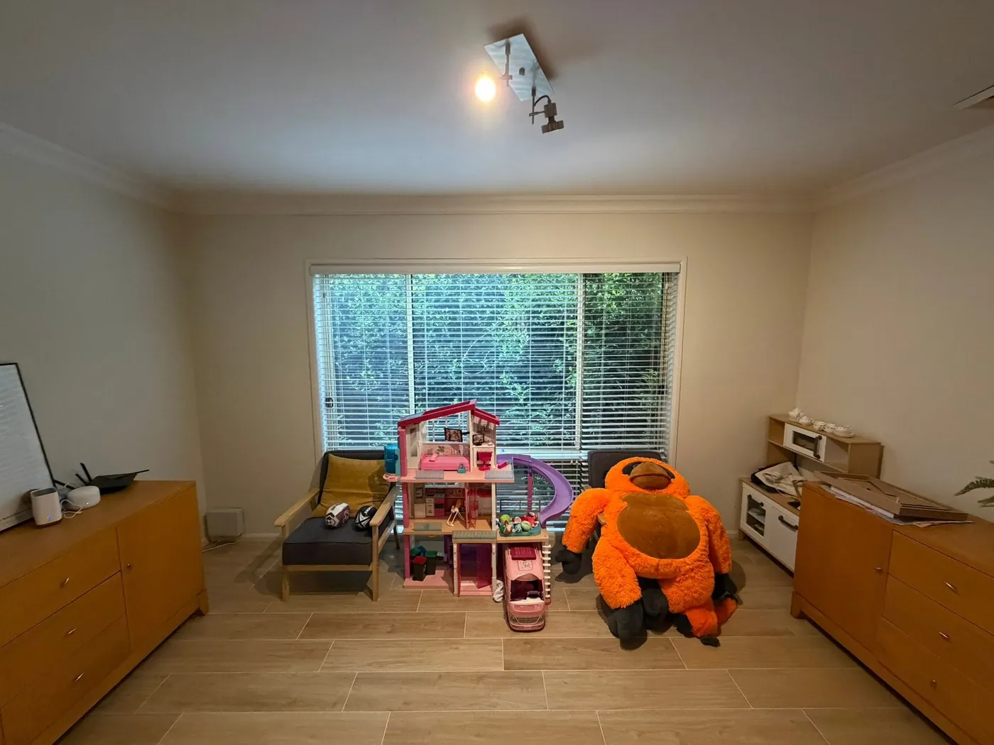 Kids' playroom full of toys, before the build