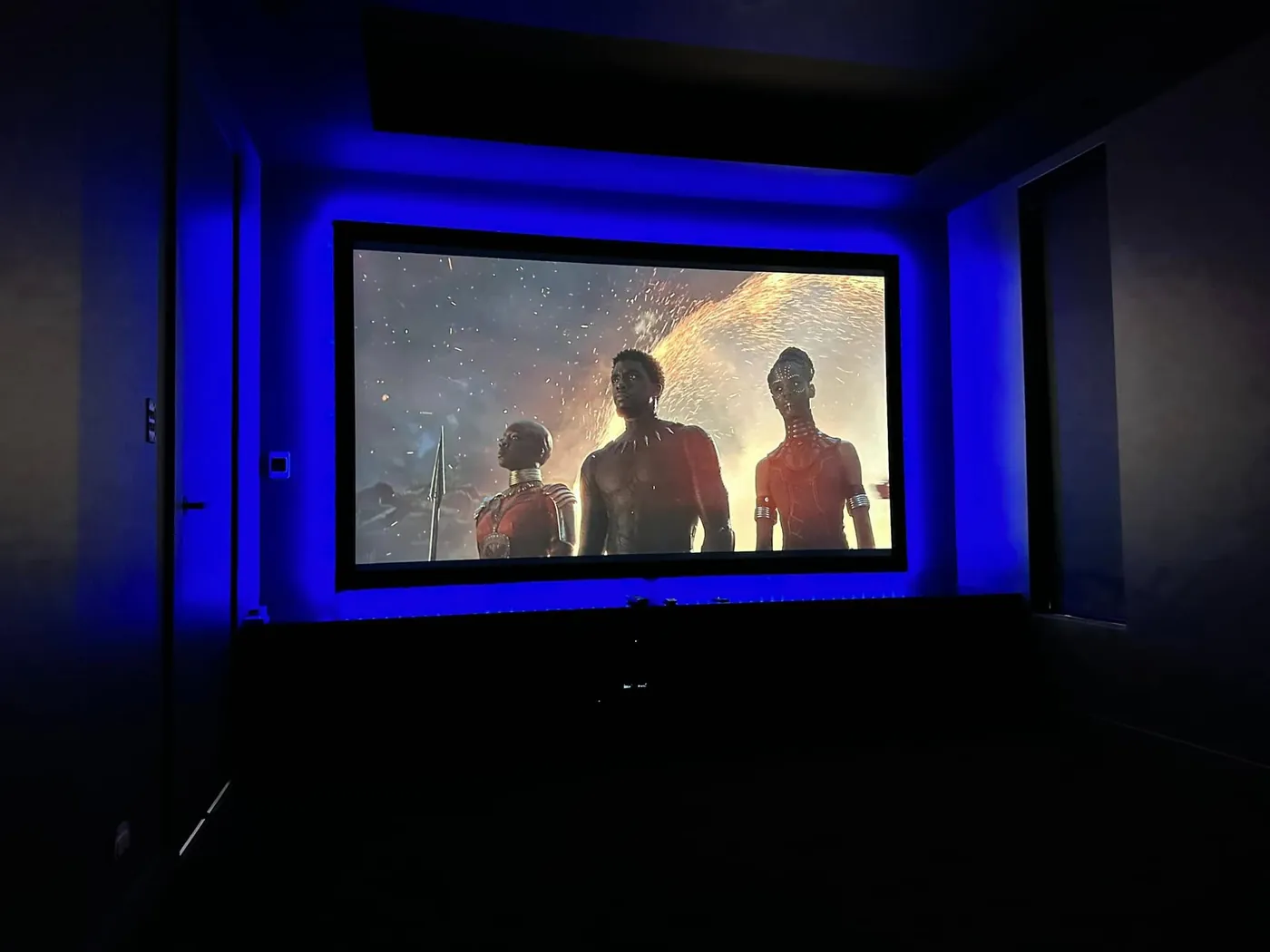 Blue LED backlighting around a projection screen
