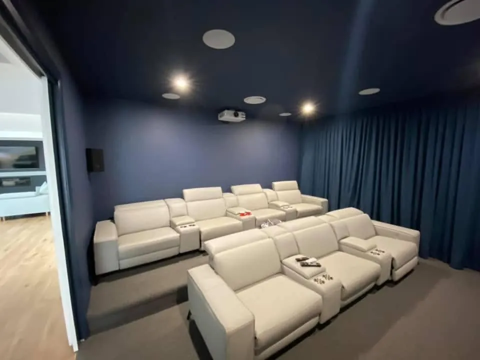 Two rows of cream leather recliners