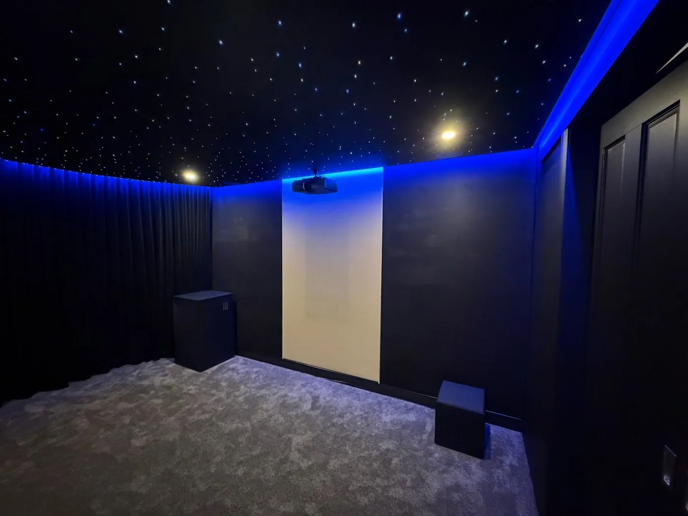 Cinema room with acoustic curtains and a star-light ceiling