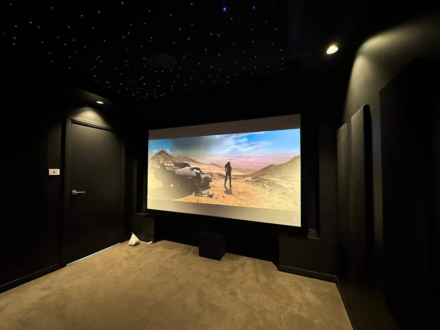 Star-light ceiling in a cinema room with a projection screen